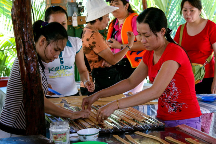 Making coconut candy mekong delta day tour